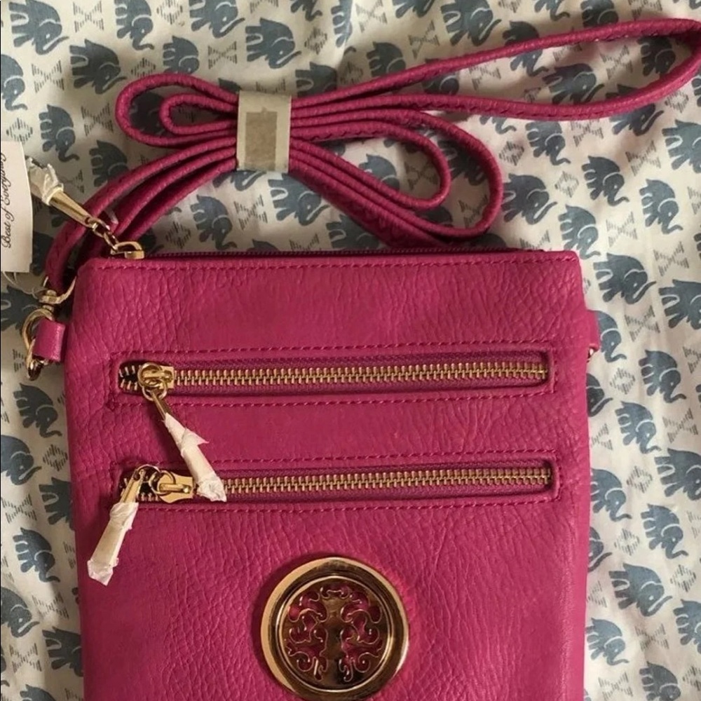Women’s pink faux leather crossbody bag